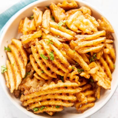 waffle fries in a white bowl
