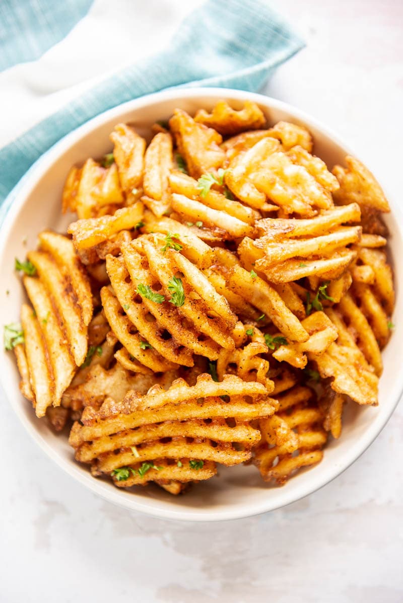 waffle fries in a white bowl