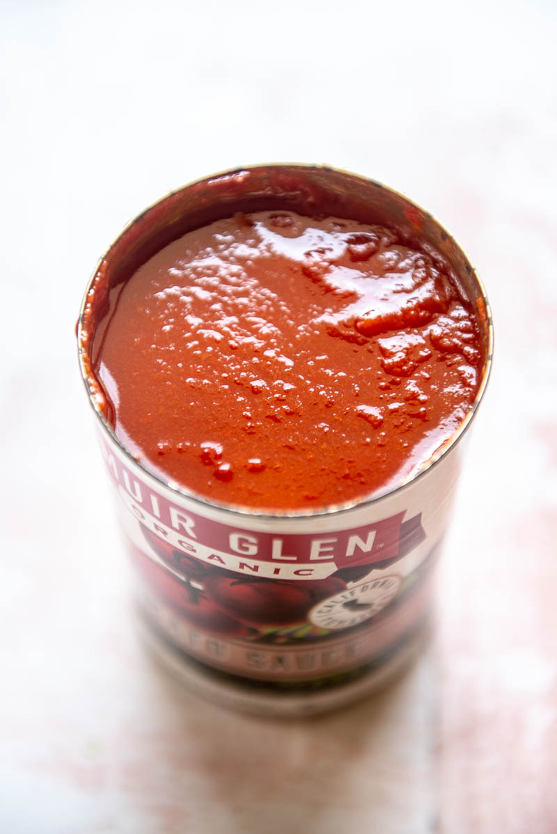 open can of tomato sauce