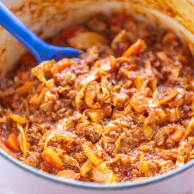 pink dutch oven with beef and cabbage casserole