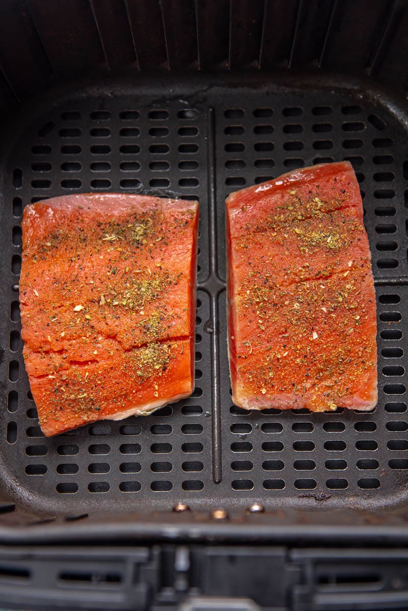 raw salmon in air fryer basket