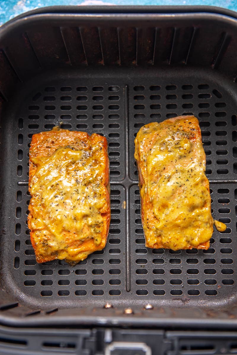 2 pieces of honey glazed salmon in air fryer basket