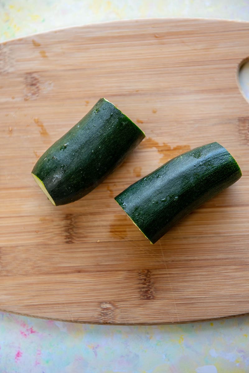 zucchini squash cut in half with ends removed