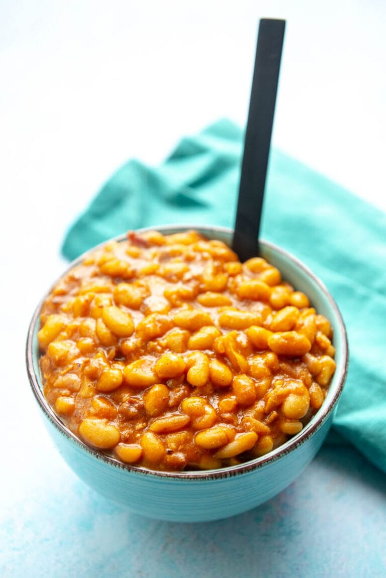 blue bowl filled with baked beans