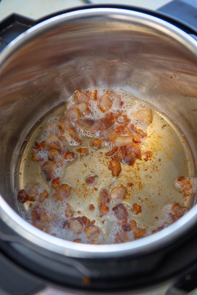 instant pot with cooked chopped bacon