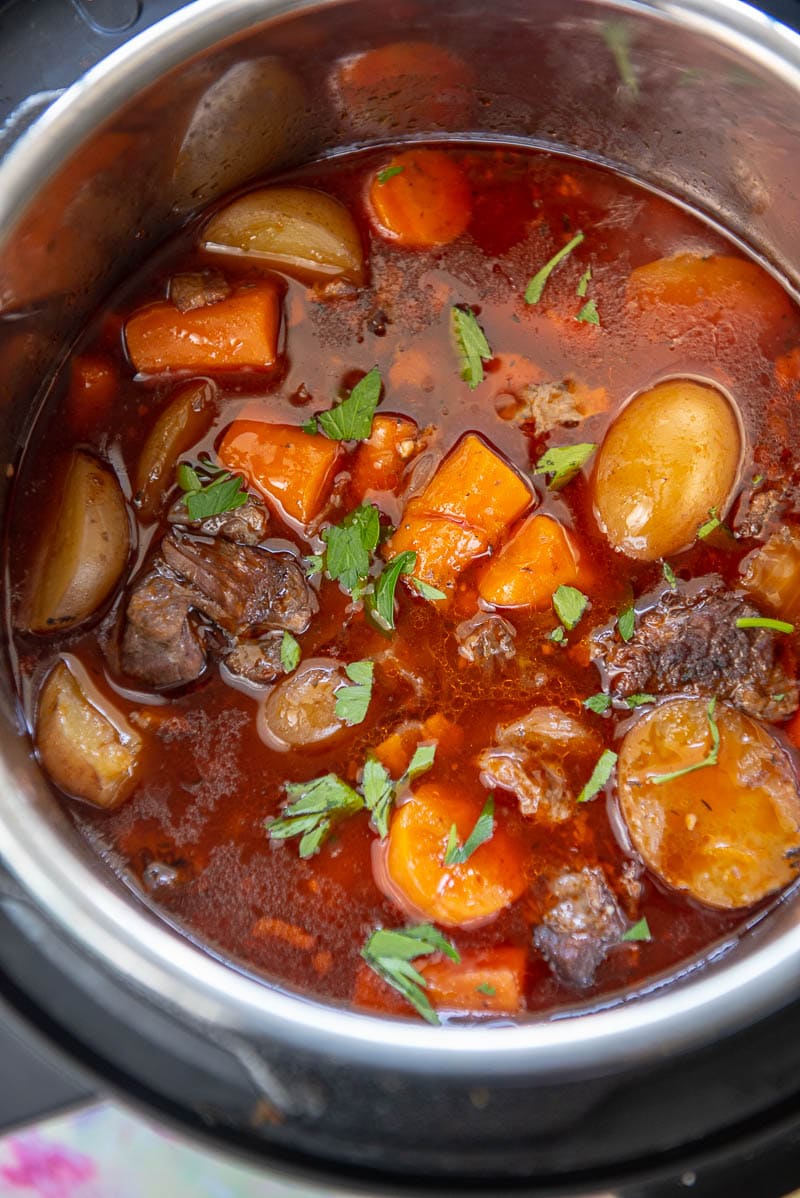 instant pot with cooked beef bourguignon