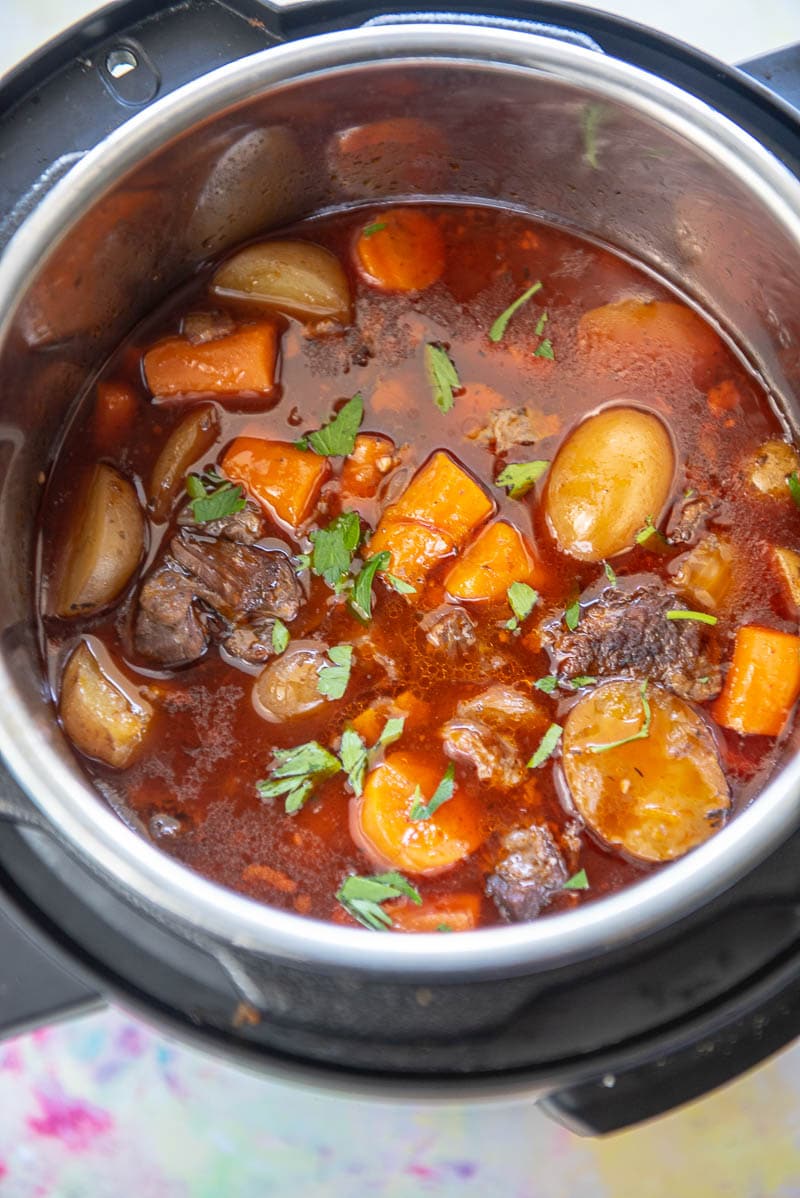 instant pot with cooked beef bourguignon