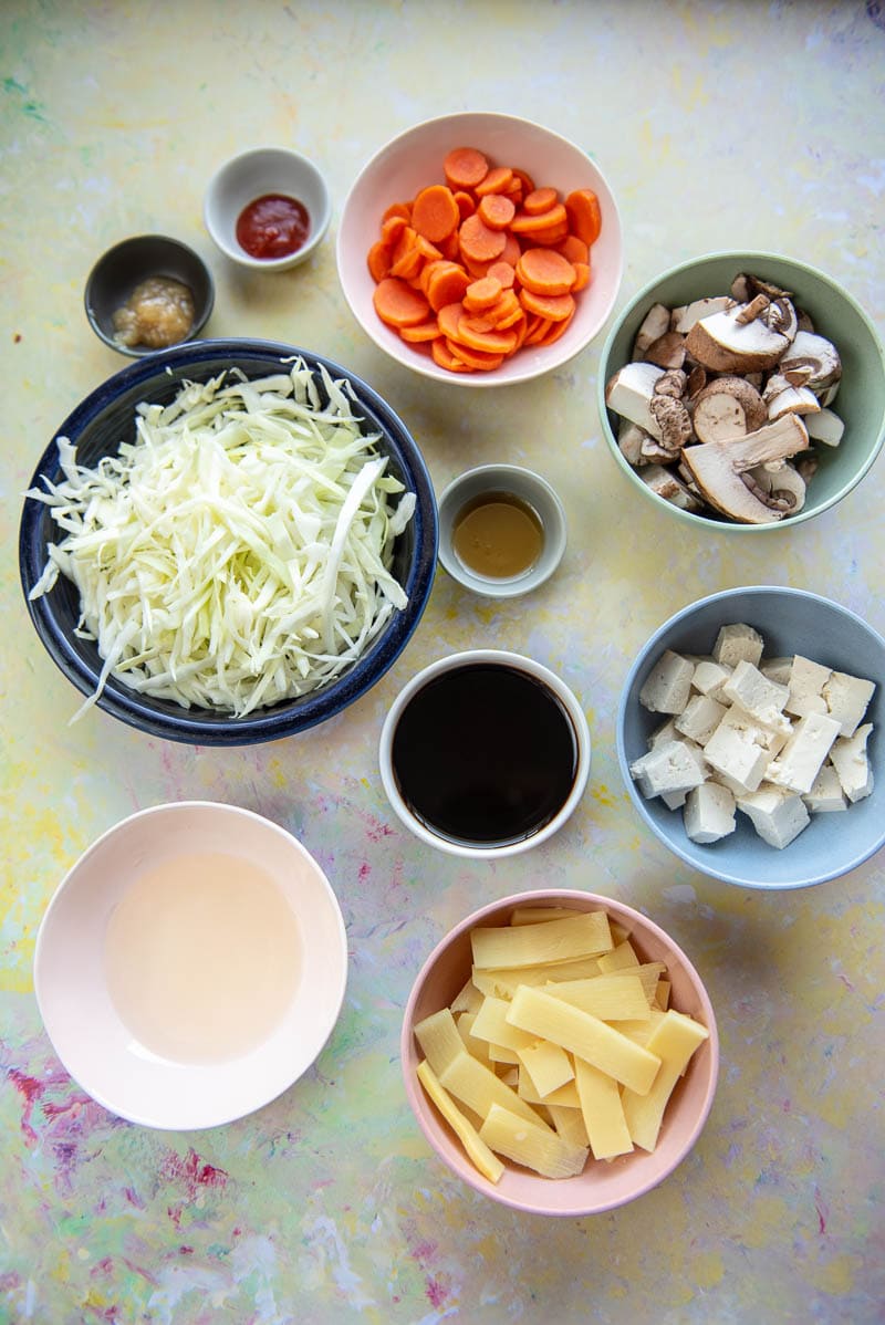 small bowls filled with ingredients to make hot and sour soup