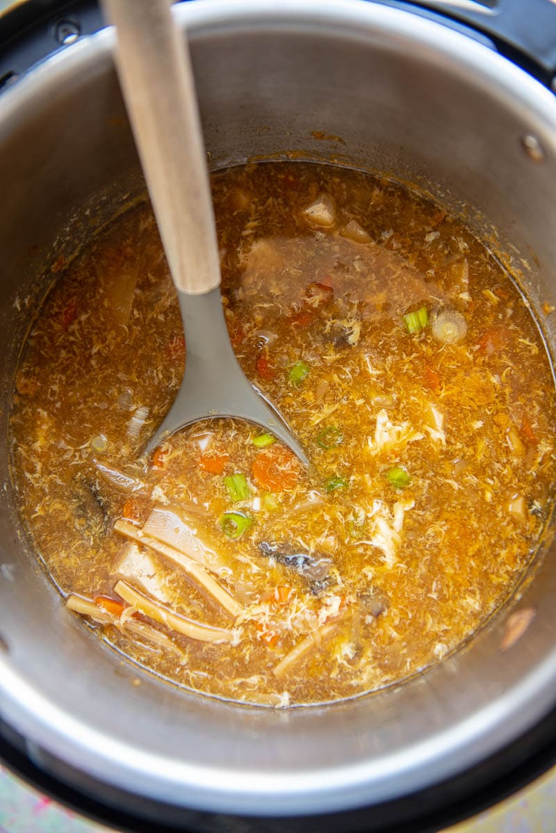 cooked hot and sour soup in instant pot with ladle