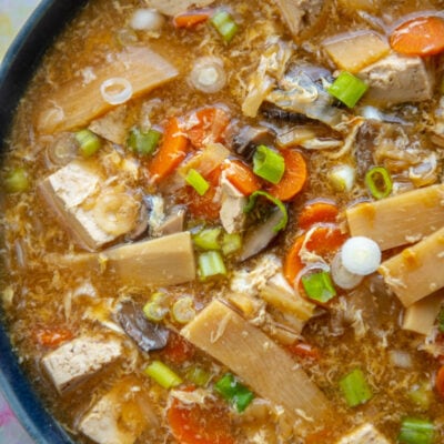 close of of hot and sour soup in a blue bowl