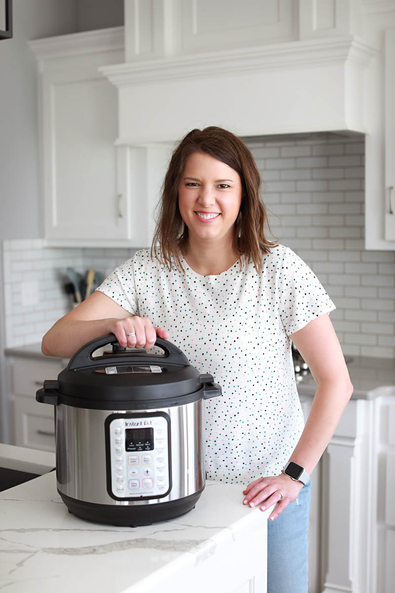 woman in white shirt next to instant pot