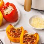 2 yellow pepper halves stuffed with ground beef mixture