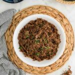 Instant Pot Shredded Beef served and garnished on plate