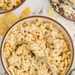 Bowl of Creamy White Cheddar Mac And Cheese with fork