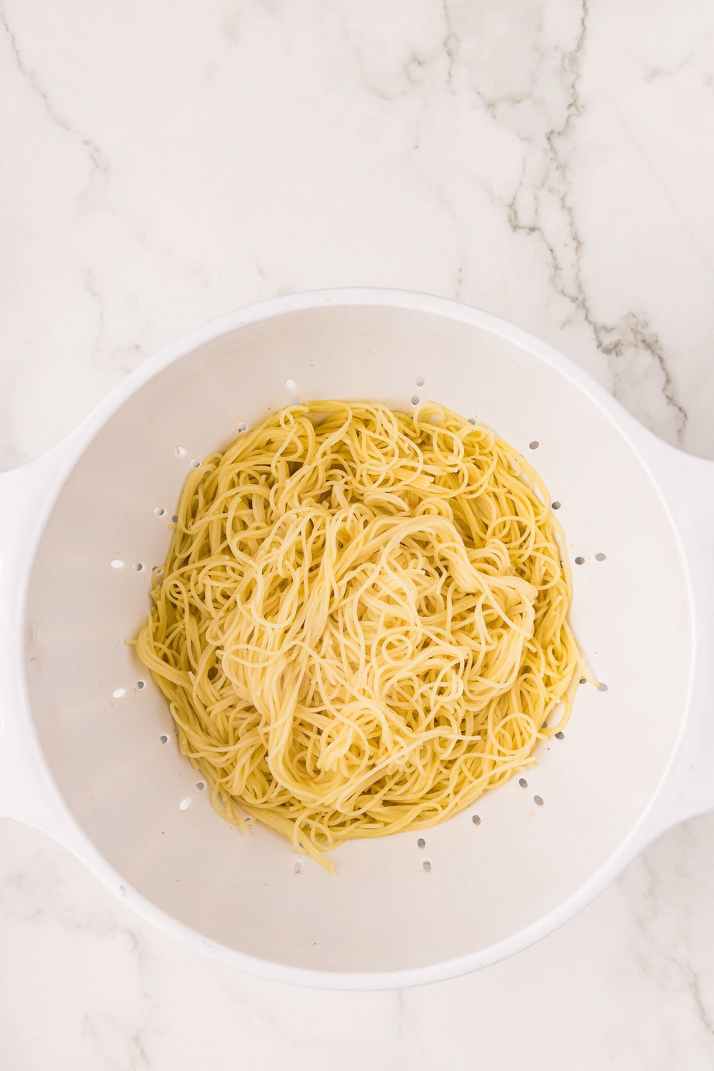 Angel hair pasta in a strainer