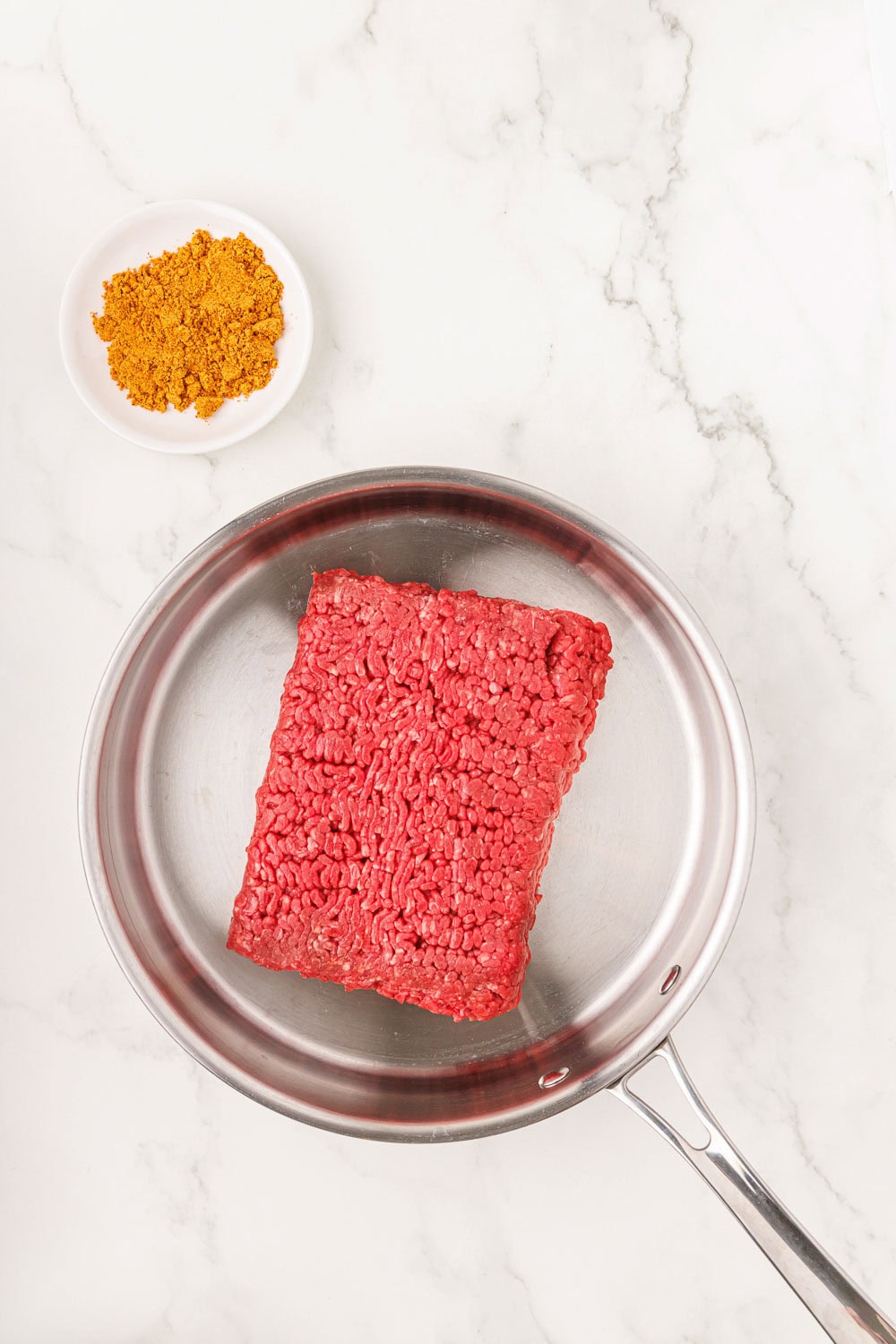 Raw ground beef in pan