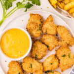 Air Fryer Chicken Nuggets served on dish with honey mustard