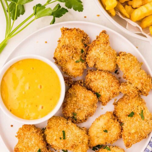 Air Fryer Chicken Nuggets served on dish with honey mustard