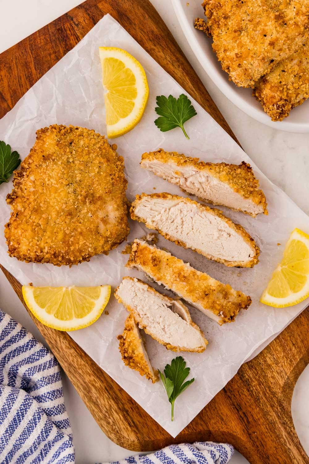 Served Crispy Air Fryer Chicken Cutlets garnished sliced