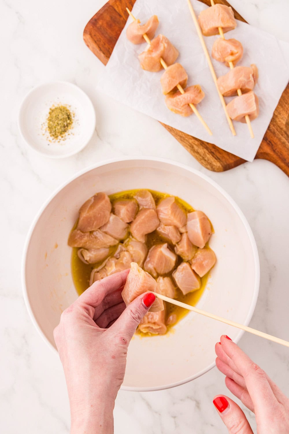Raw Herb Marinated Air Fryer Chicken Skewers in bowl