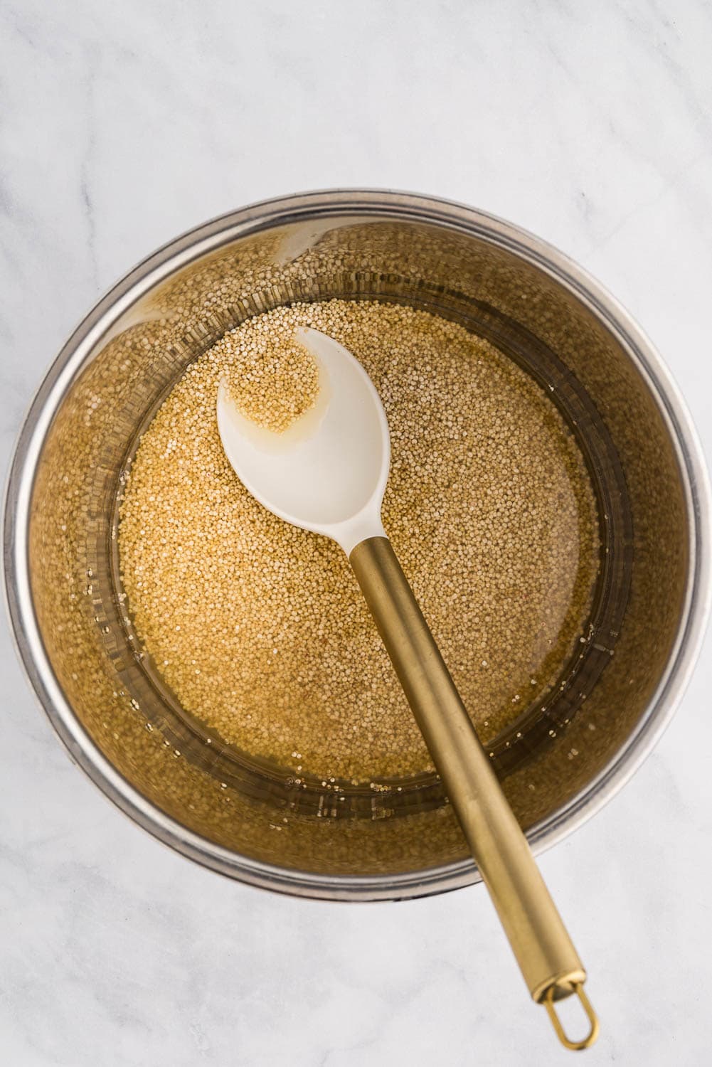 quinoa and water in instant pot ready to cook