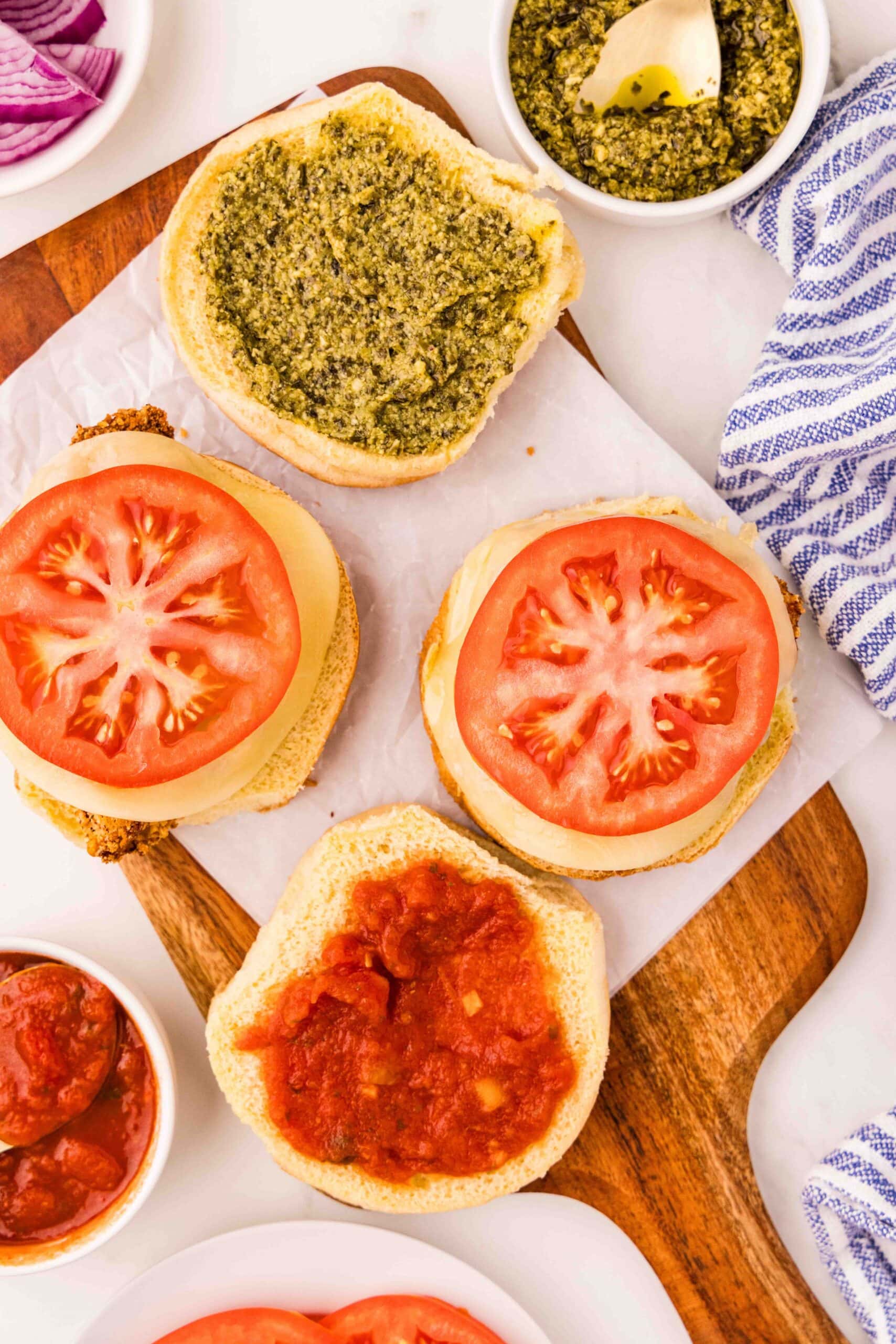 cutting board with open buns for Italian Chicken Cutlet Sandwich