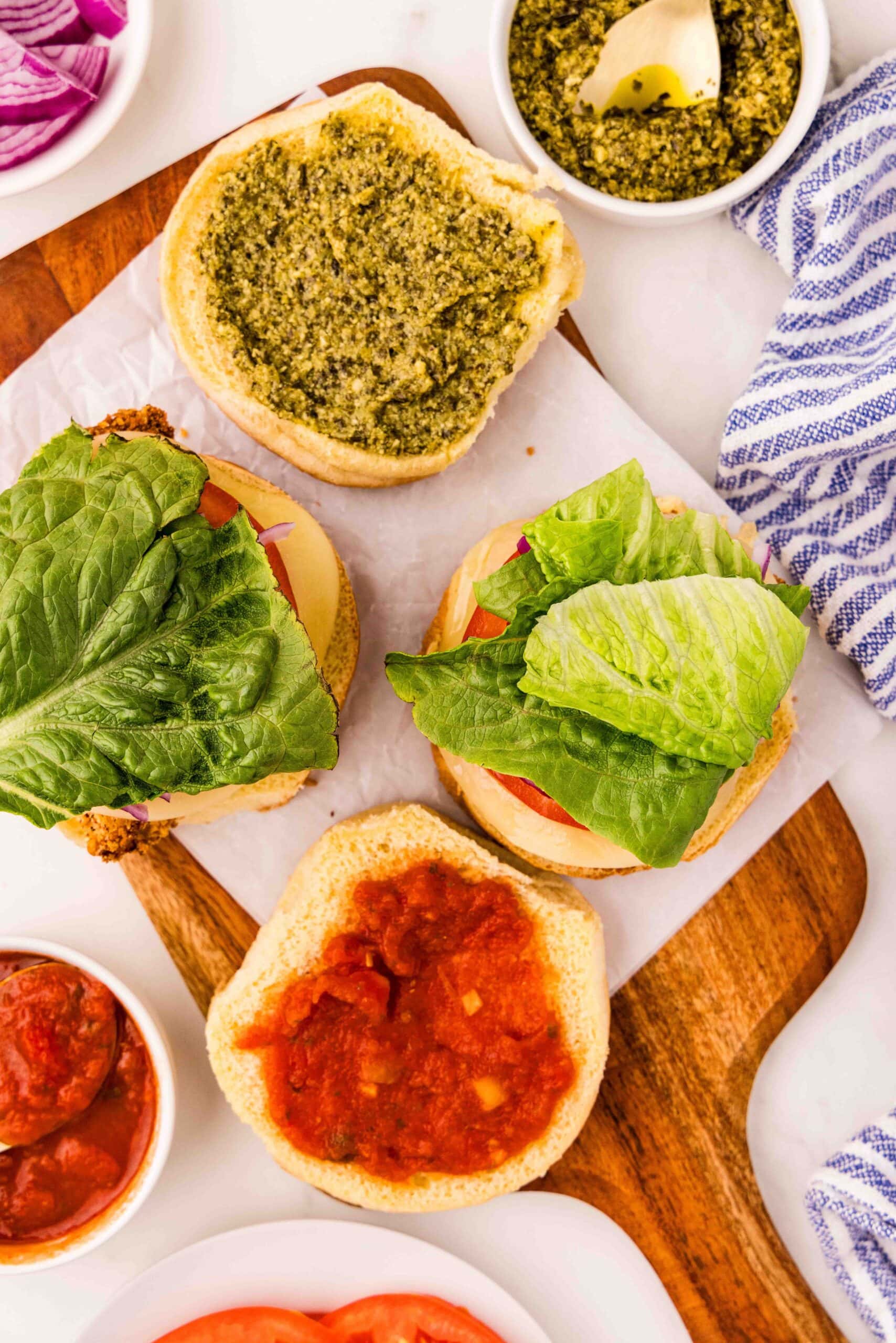 cutting board with open buns for Italian Chicken Cutlet Sandwich