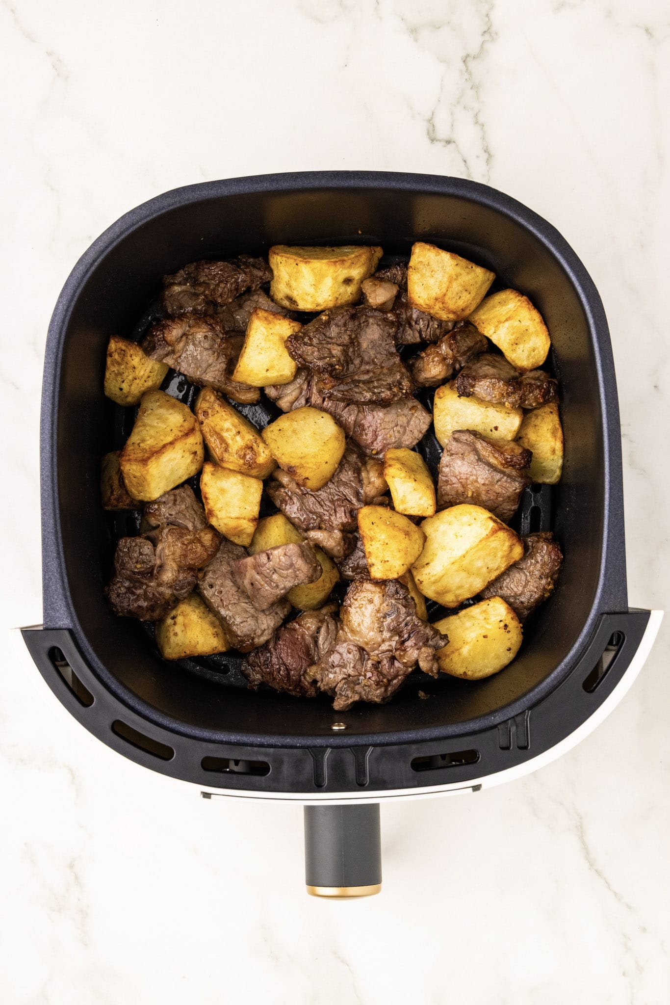 overhead shot of potatoes and steak air fried