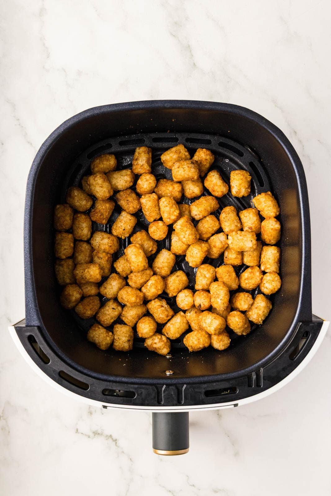 air fried tater tots in black air fryer