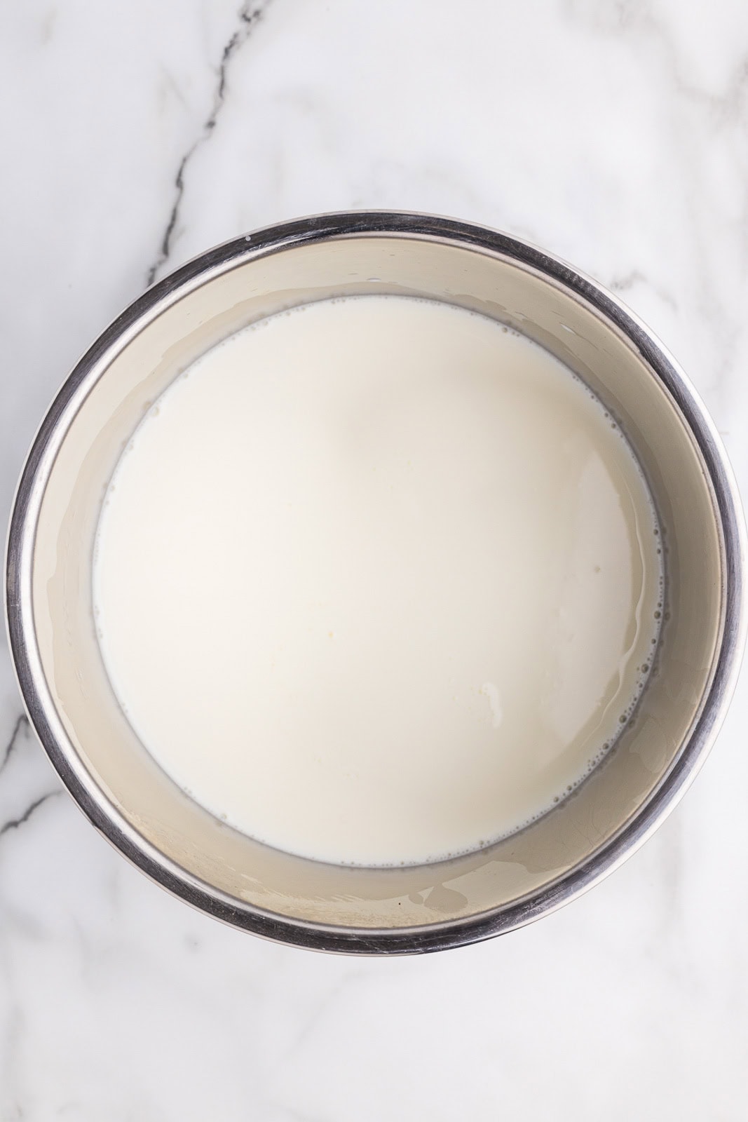 overhead view of instant pot containing milk