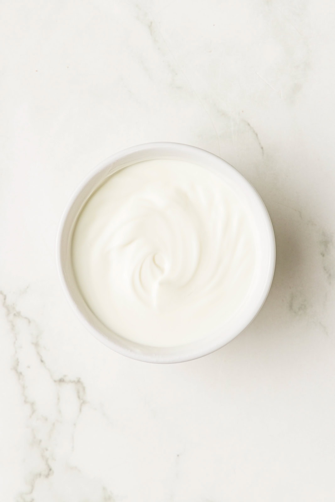 white bowl containing sour cream mixture