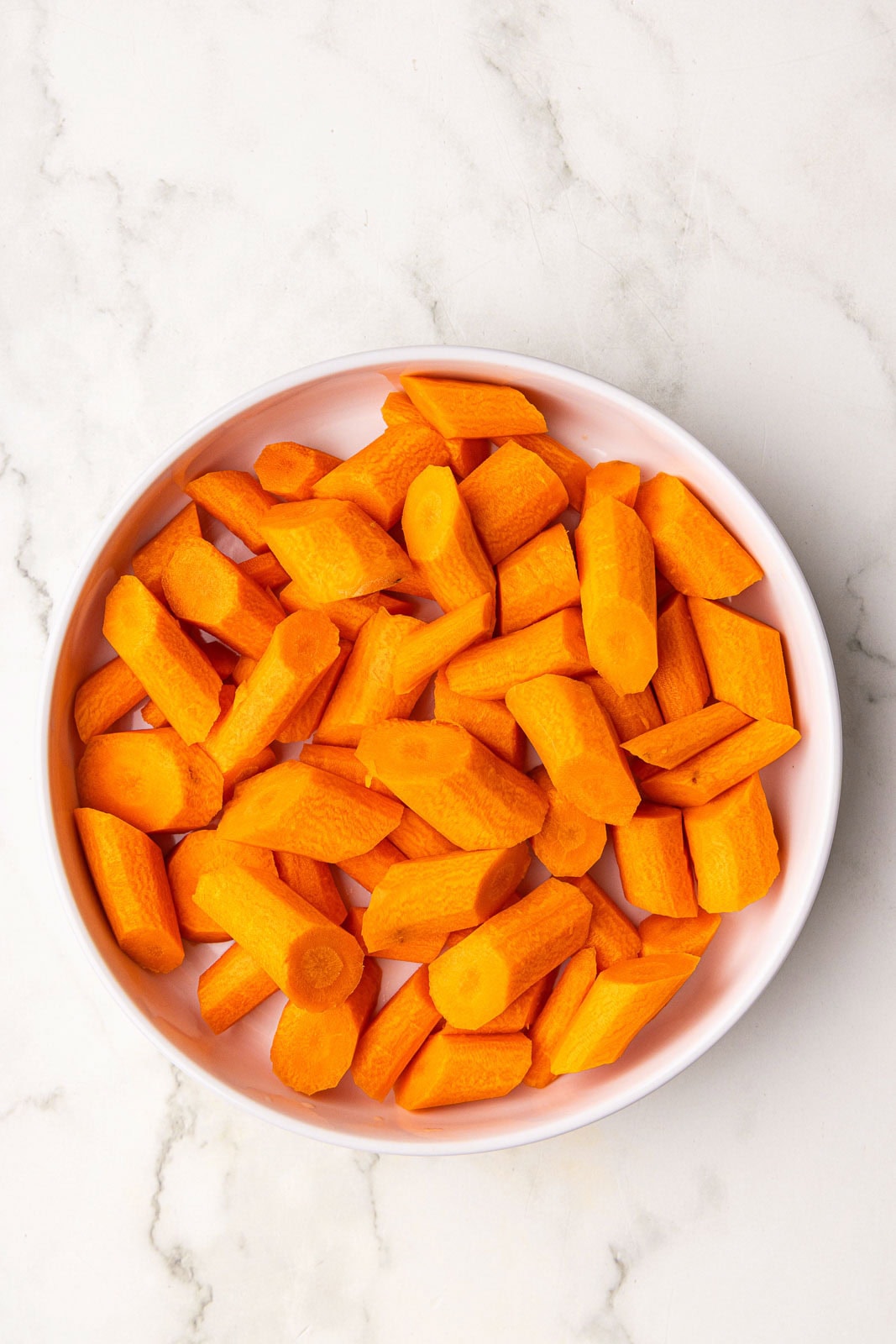 white bowl of wedged carrots